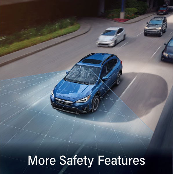 A Subaru Crosstrek in blue with the words &ldquo;More Safety Features&ldquo;. | Romano Subaru in Syracuse NY